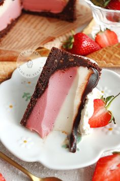 a slice of strawberry ice cream pie on a white plate with strawberries around it