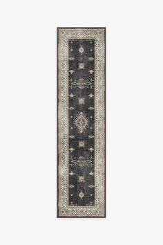 a black and white runner rug with an intricate design