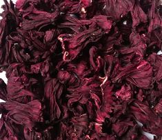 dried purple flowers on a white surface