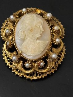 Nice Special designer Florenza brooch Carved cameo 1.75" x 1.50" one pearl missing.  varying  sizes.  email any questions prior to purchase. Study photographs as they  are a large part of the description. No returns, refunds or exchanges. Luxury Heirloom Baroque Jewelry, Palm Coast, Brooch Pin, Brooches, Product Description, Carving, Photographer, Design