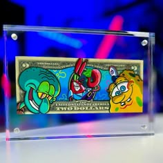 a clear acrylic sign with cartoon characters on it