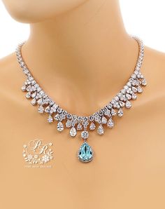 This sparkling bridal necklace featuring Light Turquoise Blue Teardrop Crystal, brilliant Cubic zirconia, platinum plated components and rhinestones. Finished off with lobster clasp. This gorgeous necklace will look elegant and beautiful quality on any classic or vintage inspired bride! Wonderful gift for both a loved one and yourself. All AAA zirconia shines a lot! Finish: Silver Platinum plated components Swarovski Crystal: Light Turquoise Material: Rhinestones, Swarovski Crystal, AAA Zirconia Blue Wedding Necklace, Sapphire Blue Wedding, Gala Jewelry, Wedding Jewelry Bride, Sapphire Blue Weddings, Jewelry Bride, Diamond Locket, Pearl Bracelet Wedding, Blue Crystal Necklace