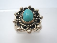 Southwestern Jewelry - This is a handmade sterling silver ring with sn overlay technique and a blue turquoise gemstone center. The ring is a size 5.5, face measures .88" by .75" and weight is 5.1 grams. It is not hallmarked, tests for sterling silver. Blue Artisan Turquoise Ring Nickel Free, Blue Sterling Silver Ring With Patina, Blue Sterling Silver Rings With Patina, Southwestern Blue Turquoise Ring With Patina, Artisan Blue Turquoise Ring Stamped 925, Artisan Turquoise Ring Stamped 925, Vintage Turquoise Ring, Handmade Sterling Silver Rings, Southwestern Jewelry