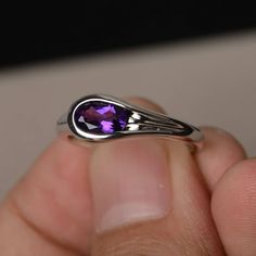 This is a gorgeous handmade creation. Its beauty is its simplicity & Elegance. The 5*7 mm oval shape faceted natural amethyst is crafted in solid sterling silver and with rhodium plated. All item is sent in a beautiful gift box If you have any idea of design your ring,pls contact me directly. You can realize more lovely stuff clicking the link https://www.etsy.com/shop/knightjewelry?refshopsection_shophome_leftnav Please leave the correct address and you phone number for delivering successfu Oval Faceted Amethyst Ring For Gift, Oval Amethyst Ring With Polished Finish For Anniversary, Oval Amethyst Rings With Polished Finish, Oval Purple Birthstone Ring With Bezel Setting, Purple Oval Birthstone Ring With Bezel Setting, Oval Amethyst Gemstones For Promise Rings, Oval Amethyst Birthstone Ring With Bezel Setting, Modern Oval Amethyst Ring For Gift, Modern Oval Amethyst Ring Gift