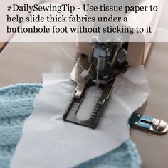 the sewing machine is cutting fabric with scissors