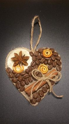 an ornament with coffee beans, cinnamons and star anise on it