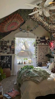 a bed room with a neatly made bed and lots of plants