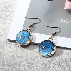 Accessories have a flat rate shipping of $2.50 worldwide. Magical celestial earrings with dangly planet, moon and star charms. Space Universe, Sailor Moon Stars, Moon And Star Earrings, Blue Space, Chain Belts, Luxury Earrings, Sun With Sunglasses, Long Sleeve Lace Dress, Moon Star