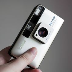 a person holding a camera in their hand