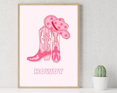 a pink cowboy boot with stars on it and the words howdy written in red