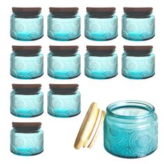 blue glass jars with brown lids are lined up