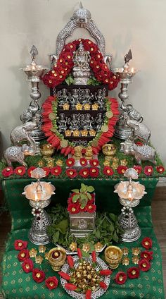 an elaborately decorated altar with candles and decorations