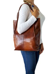 "Brown leather tote bag, brown Leather Handbag, Shoulder Bag, Leather Bag, Leather shopper, Every Day Bag, Women leather bag, Christmas Gift Tote Bag in brown, cognac, made of high-quality genuine Italian grain leather. A simple, classic model that works great for everyday days and as a gift. The bag has double handles to carry around the shoulder and hand. It is fastened with a magnet. Inside there is a zippered pocket. A casual model that will suit any style of clothing. A capacious and origin Cognac Hobo Shoulder Bag For Shopping, Cognac Hobo Bag For Shopping, Everyday Brown Tote Shoulder Bag, Large Capacity Cognac Hobo Shoulder Bag, Cognac Large Capacity Hobo Shoulder Bag, Everyday Brown Hobo Bag With Double Handle, Everyday Large Capacity Brown Hobo Bag, Brown Double Handle Hobo Bag For Everyday, Brown Shoulder Hobo Bag For Shopping