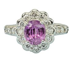 This GIA Certified Natural Purple-Pink Sapphire Platinum Natural Diamond Ring features an oval-shaped sapphire with a total carat weight of 1.84ct. The sapphire has has a very good cut grade, set in a platinum halo style setting surrounded by 18 natural diamonds. Halo Style, Natural Diamond Ring, Pink Sapphire, Fashion Set, Natural Diamonds, Halo, Diamond Ring, Platinum, Sapphire