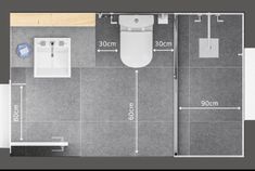 a bathroom with measurements for the toilet and sink