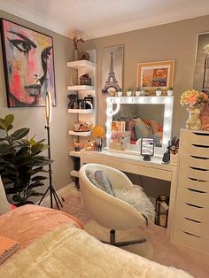 a bedroom with a vanity, chair and mirror