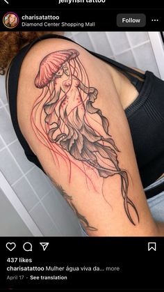 a woman's arm with a jellyfish tattoo on the left side of her thigh