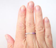 "This beaded skinny ring features a thin line of seed beads in the colors of the asexual pride flag: gray, white, purple and black. The remaining band of the ring is beaded with white seed beads. This is the ring for you if you crave a simple line of subtle color. This ring is also available with a black band - see photos. The Ace thin line ring in black is available here: https://www.etsy.com/listing/680541265/skinny-ace-pride-ring-with-black-band. ElephantBeads \"Thin Line\" beaded rings are a Pride Jewelry, Pinky Rings, Ace Pride, Pride Jewellery, Asexual Pride, Wire Crochet, White Band, Thumb Rings, Pink Beads