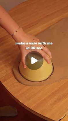 a person is pressing the button on a wooden table with text that reads make a vase with me in 30 seconds