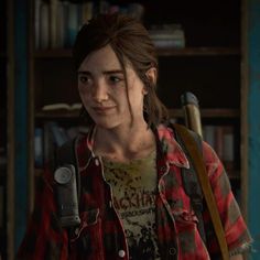 the last of us's character is standing in front of a bookshelf