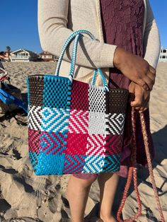 "This beautiful hand-woven, small tote is the latest creation of my business parter Cupertino. Handcrafted in Mexico. 9 1/2\"L x 9 1/2\"H x 5\"D; 16\" H with straps." Rectangular Woven Leather Beach Bag For Market, Rectangular Woven Leather Beach Bag, Woven Bags, Business Partners, Sun Valley, Business Partner, Mini Handbags, Toiletry Storage, Cute Bracelets