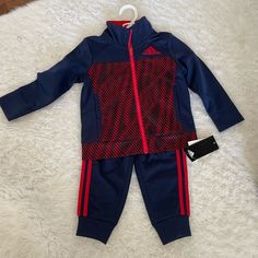 Adidas. Sweatsuit. 24. Months. New With Tags. Brand New Jacket And Sweatpants/Jogger. Red And Navy Blue Nwt Sporty Long Sleeve Playtime Sets, Blue Winter Playwear Sets, Blue Sports Sets For Winter, Blue Sportswear Sets For Winter, Winter Sports Sets In Blue, Blue Winter Sports Sets, Blue Winter Sports Set, Adidas Long Sleeve Playwear Sets, Adidas Sports Set With Long Sleeve