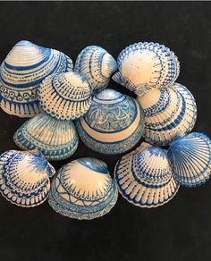 several blue and white vases sitting on top of each other