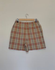 "Awesome high waisted 90's plaid shorts. High waisted fit, looser through the hips, and two front pockets. Button and zipper closure in front. Classic 90's multi colored plaid pattern. Shorts are in excellent clean condition. Measurements are taken zipped or buttoned up and laid comfortably flat then x 2 for total circumference (inches) Liz Claiborne Tag Size 10 100% Cotton Waist 28\" Hips 42\" Length 16.5\" Inseam 5\" Rise 12\" Bottom leg Opening Circumference 26\" All items are free of rips, t High Waist Plaid Summer Bottoms, Retro Plaid Bottoms With Pockets, Plaid Bottoms With Built-in Shorts For Spring, Plaid Bottoms With Built-in Shorts, Retro Short Bottoms For Fall, 90s Fitted Shorts, Fitted Plaid Shorts, Retro Bottoms With Built-in Shorts, Vintage High Waist Plaid Bottoms