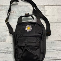 Black Daisy Embroidered Bag Brand New With Tag Black Pouch Shoulder Bag For Spring, Black Spring Pouch Shoulder Bag, Trendy Shoulder Bag With Embroidered Logo For Everyday Use, Trendy Everyday Shoulder Bag With Embroidered Logo, Casual Travel Shoulder Bag With Embroidered Logo, Casual Black Bags For Spring, Cheap Black Embroidered Shoulder Bag, Trendy Shoulder Bag With Embroidered Logo, Trendy Shoulder Bag With Embroidered Logo For Daily Use