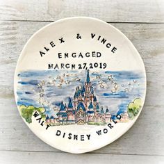 a disney world plate with the words alex and vince engaged march 27, 2009