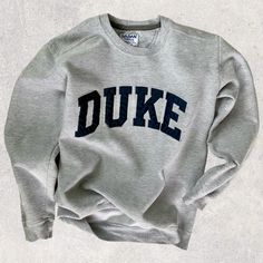 Light Gray minimal, vintage Duke Sweatshirt Classic Fall Sweater With Letter Print, Classic Winter Sweatshirt With Letter Print, Classic College Sweatshirt With Letter Print, Classic Letter Print Sweatshirt For College, Classic Crew Neck Sweatshirt With Letter Print, Classic Cotton Sweatshirt With Letter Print, Classic Crew Neck Tops With Letter Print, Vintage Crew Neck Sweatshirt For Everyday, Vintage Crew Neck Everyday Sweatshirt