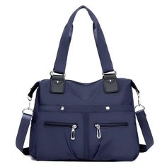 a blue handbag with two zippers on the front and one side pocket open