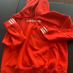 Adidas Hoodie- New Never Worn. Adidas Hoodie With Ribbed Cuffs For Sports Season, Adidas Hoodie With Three Stripes For Sports Season, Red Hoodie With Double-lined Hood For Fall, Red Fall Hoodie With Double-lined Hood, Adidas Hoodie With Three Stripes, Adidas Three Stripes Hoodie Sweatshirt, Adidas Hoodie Sweatshirt With Three Stripes, Red Hoodie Sweatshirt With Adjustable Hood, University Red Long Sleeve Hoodie For Sports