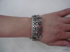 "Vintage Antique ethnic collectible very nice tribal old silver charm Bracelet or bangle pair from Rajasthan India. Worn by Banjara tribal people of Rajasthan. Beautiful workmanship all over the piece, adorn with silver charms. One quarter-hinged part can be open by pin. Original old pair in good condition with great antique look. great pair for jeweley collection. Inner diameter across - 5.3 cm(2\") Inner circumference -16.6 cm (6.5\") width include charms - 2.6 cm(1\") weight for pair - 92.5 g Silver Metal Bohemian Cuff Bracelet, Silver Bohemian Metal Cuff Bracelet, Bohemian Silver Metal Cuff Bracelet, Silver Oxidized Bangle For Festival, Bohemian Silver Cuff Bracelet, Handmade Silver Bangle Charm Bracelet, Bohemian Silver Cuff Bracelet With Silver Beads, Silver Bangle With Oxidized Finish For Festival, Bohemian Oxidized Silver Cuff Bracelet