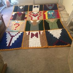 a blanket made out of legos on the floor