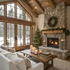 a living room filled with furniture and a fire place in front of a stone fireplace