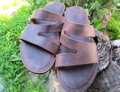 Men's comfortable and high quality sandals made from genuine cowhide leather. Available in a vintage brown color and natural color. Strong and durable slide sandals also featuring stitched soft padded leather insoles and slip resistant rubber soles. Please check below for correct size. EU=40 (26.5cm)UK=6US=7 EU=41 (27cm)UK=7US=8 EU=42 (27.5cm)UK=8US=9 EU=43 (28.5cm)UK=9US=10 EU=44 (29cm)UK=10US=11 EU=45 (29.5cm)UK=11US=12 EU=46 (30cm)UK=12US=13 EU=47 (30.5cm)UK=13US=14 Orders are shipped by regi Brown Rugged Sandals For Summer, Rugged Brown Sandals For Summer, Rugged Brown Summer Sandals, Rugged Brown Sandals With Leather Footbed, Rugged Brown Slip-on Sandals, Brown Rugged Open Toe Sandals, Rugged Brown Leather Sandals, Mens Slide Sandals, Sandals Comfortable