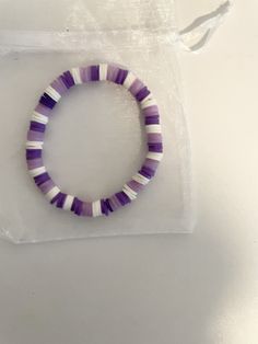 Purple handmade beaded bracelet Handmade Heishi Beads Round Bracelets, Handmade Heishi Beads Bracelets, Handmade Inelastic Bracelets With Round Beads, Handmade Inelastic Round Beads Bracelets, Handmade Inelastic Beaded Bracelets With Round Beads, Colorful Heishi Beads Bracelet, Handmade Purple Stretch Bracelet For Beach, Trendy Handmade Purple Wristband, Handmade Casual Heishi Beads Bracelets