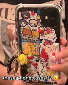 someone holding up their cell phone case with many stickers on it and the text, these phone cases > >