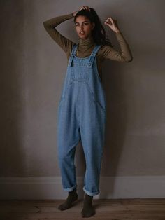 The perfect dungaree to accessorize your everyday life, these relaxed-fit overalls were designed with vintage vibes to be worn all season long. Made from our signature denim, it features adjustable straps and a suuuper comfy, oversized fit. Layer it to perfection with The Oversized Tee or The Chunky Sweater. Our small- Relaxed Fit Overalls With Adjustable Straps For Spring, Spring Overalls With Adjustable Straps In Relaxed Fit, Spring Overalls With Adjustable Straps And Relaxed Fit, Utility Overalls With Relaxed Fit For Everyday, Fall Cotton Shortalls In Relaxed Fit, Cotton Shortalls With Relaxed Fit For Fall, Fall Overalls With Adjustable Straps, Casual Relaxed Fit Shortalls For Fall, Everyday Dark Wash Overalls With Pockets