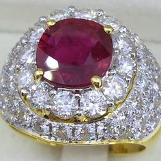 Luxury Ruby Cluster Ring, Luxury Ruby Cluster Ring With Center Stone, Luxury Cluster Ruby Ring With Center Stone, Luxury Ruby Cluster Ring With 17 Jewels, Luxury Ruby Cluster Ring With Gemstones, Exquisite Ruby Ring With 17 Jewels, Luxury Ruby Cluster Jewelry, Luxury Ruby Rings With Prong Setting, Luxury Ruby Cluster Ring For Formal Occasions