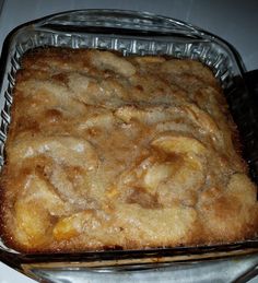 a baked dessert in a glass dish on top of a stove