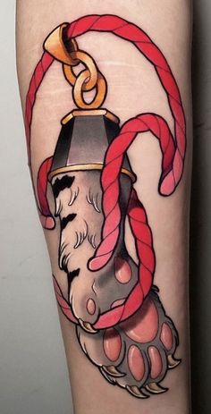 a tattoo on the leg of a person with a candy cane in it's hand