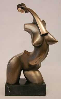 a bronze sculpture of a dog with its head in the air and it's mouth open