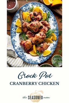 an advertisement for crock pot cranberry chicken on a plate with oranges