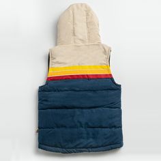 The Epic Fader Puffer Vest is the ultimate fusion of function and fashion. With its vibrant, vintage-inspired exterior and cozy layer of soft micro-flannel on the inside, this retro puffer vest looks as good as it feels. The fill is 100% polyester and the outside fabric is a plush, water-resistant cotton. Additional features are 2 inside pockets and high-quality YKK® Zippers. Get one now and let your retro style shine! Female Model is 5'7" / 125 lbs and is wearing a size XS Male Model is 5'11" / Casual Cotton Puffer Jacket With Double-lined Hood, Winter Outdoor Vest With Fleece Lining, Casual Cotton Vest For Winter, Winter Cotton Puffer Jacket With Fleece Lining, Retro Hooded Cotton Outerwear, Retro Cotton Hooded Outerwear, Casual Multicolor Puffer Jacket For Outdoor, Multicolor Cotton Winter Vest, Outdoor Cotton Puffer Jacket With Fleece Lining