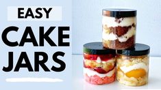 three jars with cake in them sitting on a table next to the words easy cake jars