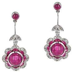 A pair of Ruby Cabochon and Diamond Earrings made in Platinum. The total weight is 7.50 grams. The large ruby cabochons weigh 4.45 carats. The small ruby cabochons weigh 0.53 carats. Anniversary Diamond Cabochon Earrings, Luxury Drop Cabochon Earrings, Ruby Cabochon Earrings, Luxury Ruby Cabochon Diamond Ring, Stephen Webster Jewelry, Luxury Cabochon Ruby Gemstones, Jewellery Sketches, Ruby Necklace, Precious Jewels