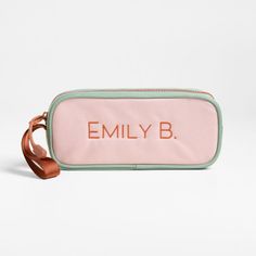 A fun pencil case that's built to handle all the thrills of the day. Colorblocked in candyfloss pink and mint green, the bag has a contrasting tawny brown zipper, zipper pull and loop handle for the perfect finish. Constructed of supremely durable polyester fabric that includes recycled plastic bottles, our roomy, easy-clean case makes it simple to keep all their pens and pencils organized and accessible. Pair with the Colorblock Pink and Mint Green lunch box and matching backpack for a totally Pink Portable Rectangular Pencil Case, Trendy Pink Stationery For Daily Use, Pink Rectangular Pencil Case For School, Pink Bags With Pen Slots For Personal Use, Trendy Green Pencil Case For School, Rectangular Pink Pencil Case For School, Pink Rectangular Travel Stationery Case, Green Pencil Case With Zipper For School, Green Pencil Case With Zipper Closure For School