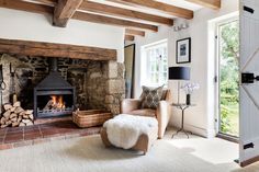 a living room filled with furniture and a fire place